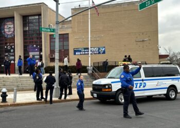 NYPD and School Safety standing outside Martin Van Buren High School in Queens, following a reported stabbing incident on 1st February 2024.
