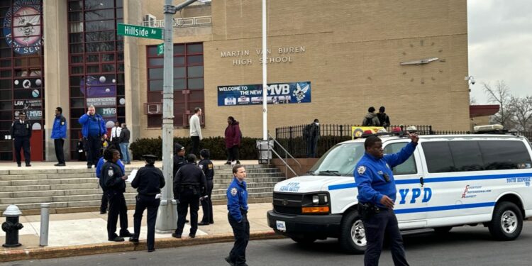 NYPD and School Safety standing outside Martin Van Buren High School in Queens, following a reported stabbing incident on 1st February 2024.