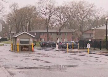 The shooter opened fire into the man's car, striking a wallet that the victim kept in his pocket, police said.