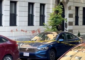 A 29-year-old woman was stabbed to death in front of her Manhattan home early Monday