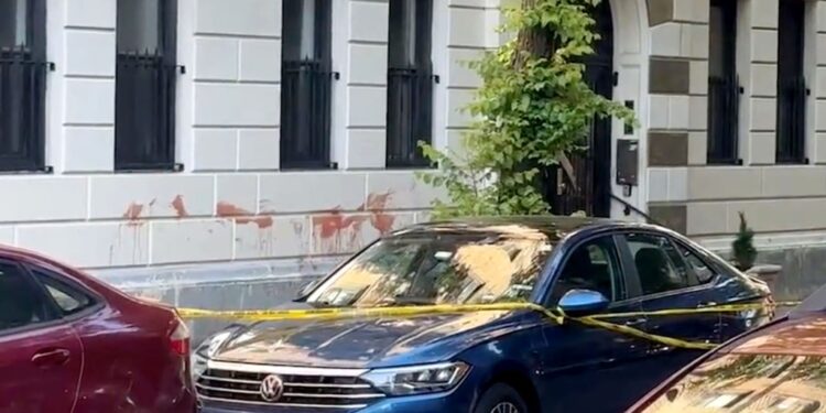 A 29-year-old woman was stabbed to death in front of her Manhattan home early Monday