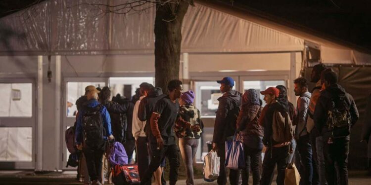 A migrant attacked and bit a security guard at the shelter on Randall's Island when the guard attempted to break up a fight between the man and his wife on Monday.