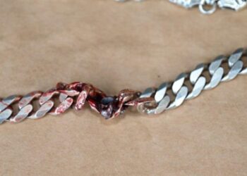 Police from Commerce said the braided metal necklace was the only thing between the man and his maker when he was shot at following an argument with another man on Tuesday.