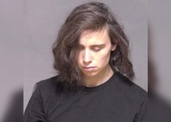 Margot Lewis, 32, was arrested in Minnesota after police said a dead body was found in the back seat of a vehicle she was driving.