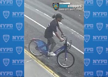 A picture of the man riding the bike.