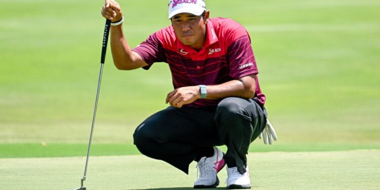 Hideki Matsuyama lines up a putt on the 17th green during the second round of the FedEx St. Jude Championship golf tournament at TPC Southwind.