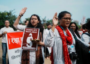 Indians protesting against the rape and killing of a trainee doctor at a government hospital in Kolkata, hold placards in Mumbai, India, Monday, Aug. 19, 2024.