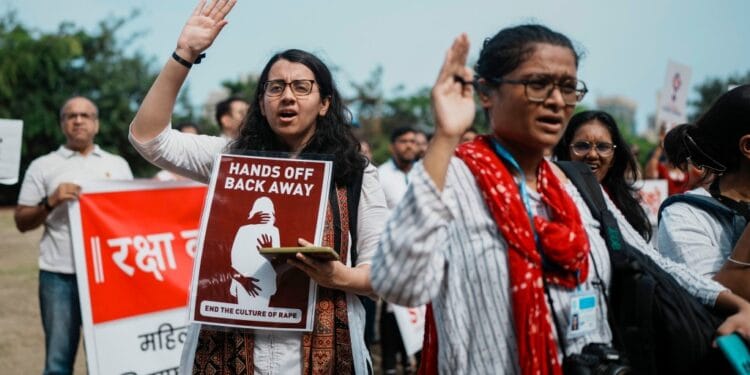 Indians protesting against the rape and killing of a trainee doctor at a government hospital in Kolkata, hold placards in Mumbai, India, Monday, Aug. 19, 2024.