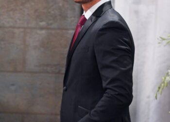 Johnny Wactor in a suit on the set of General Hospital, episode 14811
