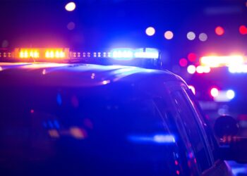 Cop car lights on at night