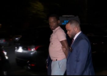 Ishmael Francis being escorted out of the Bronx Special Victims Unit by police