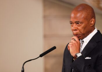Mayor Eric Adams holding a press conference in City Hall on Oct. 1.