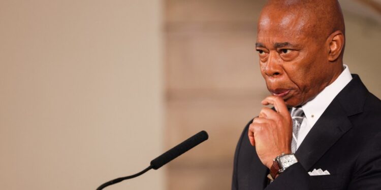 Mayor Eric Adams holding a press conference in City Hall on Oct. 1.