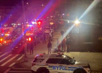 Authorities at the crime scene investigating the shooting, which left the teen in critical condition.