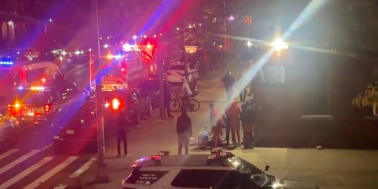 Authorities at the crime scene investigating the shooting, which left the teen in critical condition.