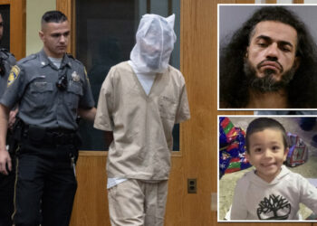 Stepdad charged with beating boy with bat wears spit mask to court