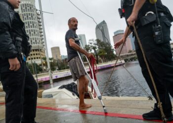 Tampa police try to persuade a local resident who is living on his boat known as Jay and nicknamed Lieutenant Dan to leave for his safety as Tampa prepares for the arrival of Hurricane Milton on October 09, 2024 in Tampa, Florida