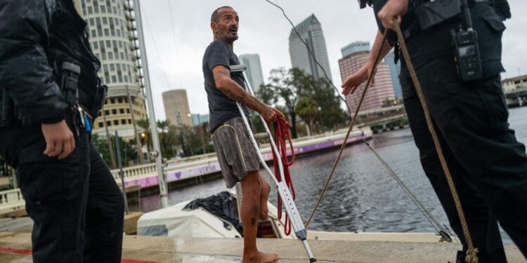 Tampa police try to persuade a local resident who is living on his boat known as Jay and nicknamed Lieutenant Dan to leave for his safety as Tampa prepares for the arrival of Hurricane Milton on October 09, 2024 in Tampa, Florida
