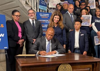 Adams signs controversial hotel bill but fight seems far from over