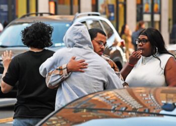 People gather after a fatal stabbing occurred inside 65 W 96 St., NYC