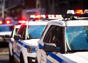 New York NYPD Police car with sirens at day on street