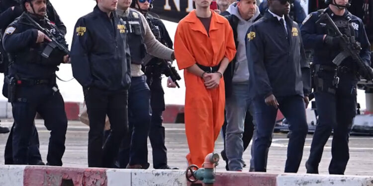 Luigi Mangione escorted by police as he arrives in New York to face federal murder charges (Video)