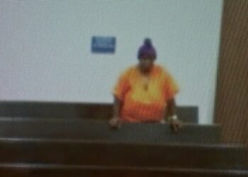 A person in an orange shirt with Fox San Antonio logo