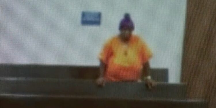 A person in an orange shirt with Fox San Antonio logo