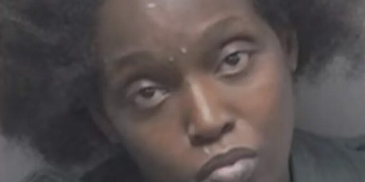 Woman with puffy hair, identified as Mallori Patrice Strait, being arrested by Texas authorities