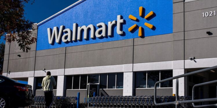 A man walking past a Walmart store in Martinez, California ahead of its earnings release