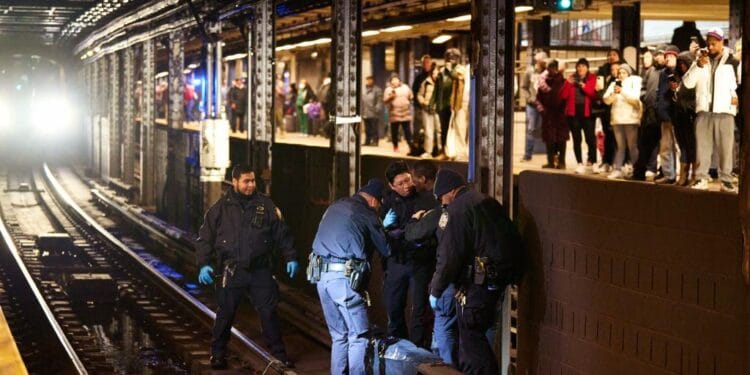 NYPD officers rescuing an emotionally disturbed man stuck on the third-rail at the 42nd St-Port Authority subway station