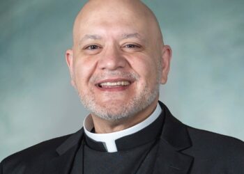 Father Carlos Martins, 50, was arrested and charged with misdemeanor battery.