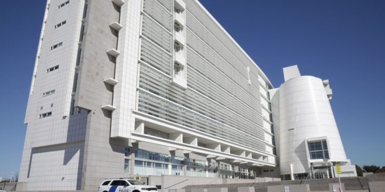 The United States District Court in Central Islip is shown.