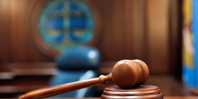 A judge's gavel is shown.