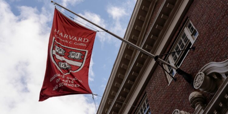 A Graduate School of Arts and Sciences flag flying on Harvard University campus, Cambridge, Massachusetts, amid escalating tensions with President Trump's administration on April 16, 2025.