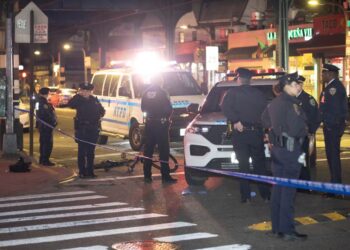 Police are seen at the scene of a stabbing at Roosevelt Ave. and Junction Blvd in Queens, Monday, April 14, 2025.