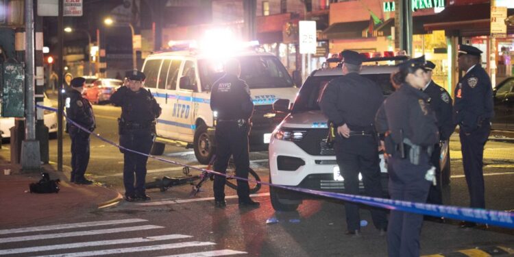 Police are seen at the scene of a stabbing at Roosevelt Ave. and Junction Blvd in Queens, Monday, April 14, 2025.