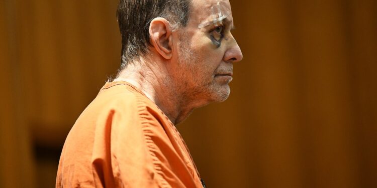 Defendant Zvi Levran, 68, in an orange shirt, attentively listening during his court hearing at Oakland County Circuit Court, Pontiac, Michigan, 2025