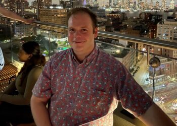 This photo provided by Linda Clary shows her son John Umberger at a rooftop bar in New York, on May 27, 2022.