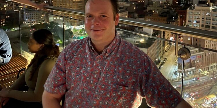 This photo provided by Linda Clary shows her son John Umberger at a rooftop bar in New York, on May 27, 2022.