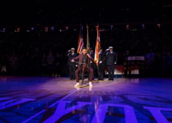Cellist Iain Forrest playing at Knicks game at Madison Square Garden