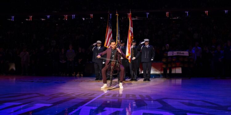 Cellist Iain Forrest playing at Knicks game at Madison Square Garden