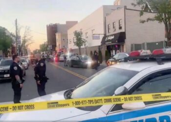gunman fleeing a traffic stop on Staten Island opened fire on a police cruiser, brazenly shooting through his own windshield and hitting the car
