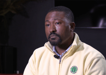 State Rep. Terrence Upchurch, a Black man, wears a pale yellow zip-up pullover during an interview with News 5 Cleveland.