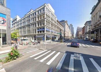 A “disheveled lunatic” allegedly used a metal rod to smash the head of a pregnant woman on Tuesday afternoon.