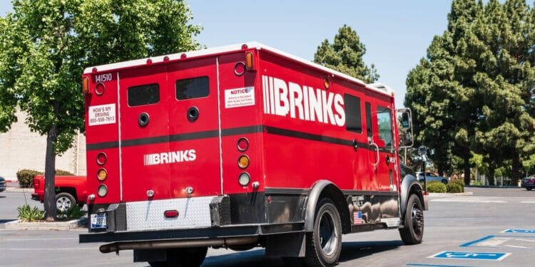 The armed pair brazenly swooped up an undetermined amount of cash from a Brinks truck outside a Cambria Heights Bank of America, police said.