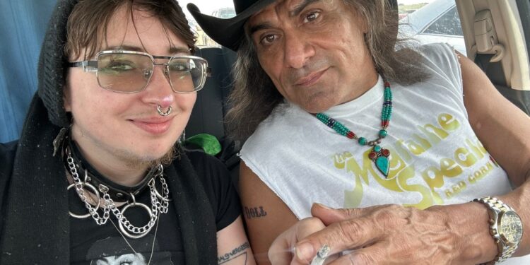 Jonathan Joss and his husband, Tristan Kern de Gonzales, in a car.