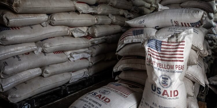 Sacks of USAID yellow peas in a storage facility.