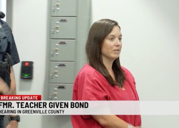 Screenshot of Nicole Ballew Callaham at a court hearing.  A banner reads "FMR. TEACHER GIVEN BOND Hearing in Greenville County".