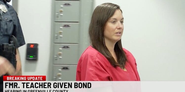 Screenshot of Nicole Ballew Callaham at a court hearing.  A banner reads "FMR. TEACHER GIVEN BOND Hearing in Greenville County".